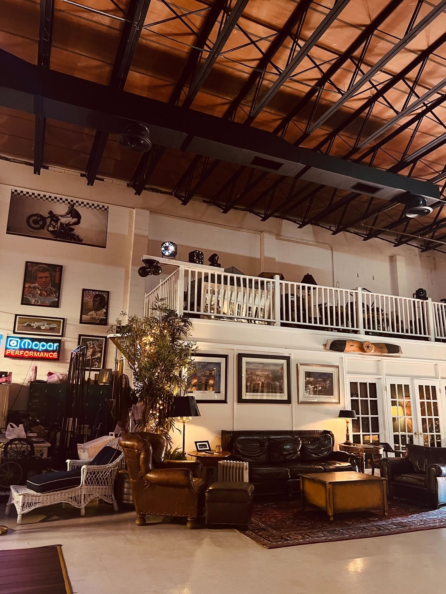Leather lounge seating beneath the mezzanine at an evening event